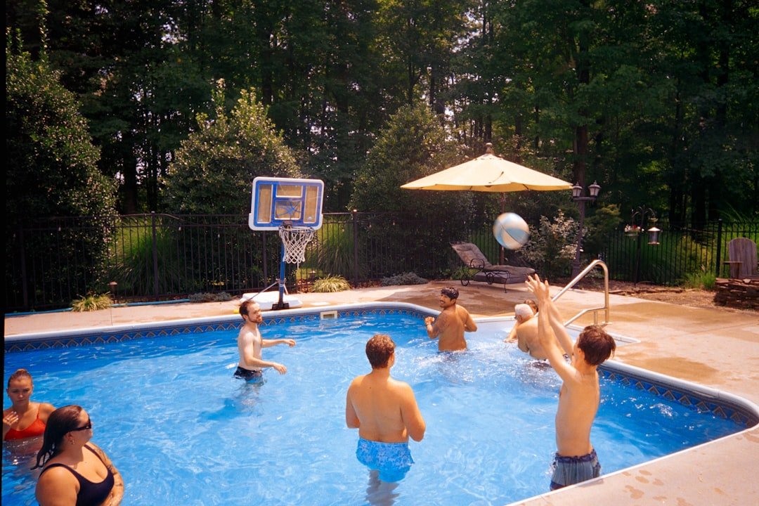 Family enjoying a backyard swimming pool